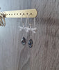 Rhodium plated dragonfly earrings with "Black Silver Night" Swarovski crystal drops on jewellery display
