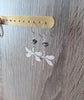 Rhodium plated dragonfly earrings with Black Silver Night Swarovski crystals on jewellery display