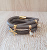 Taupe triple wrap leather bracelet with gold dragonfly and Austrian crystal charms
