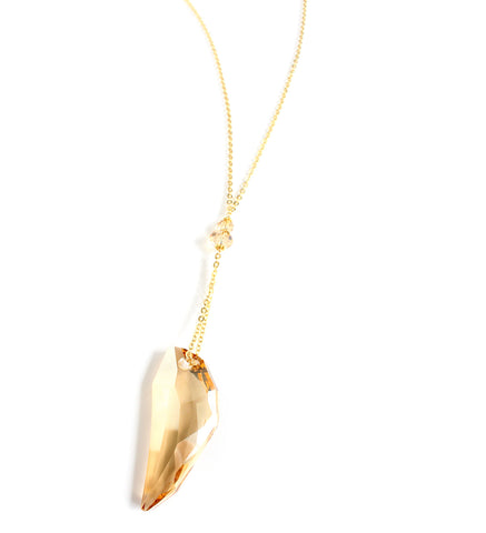 Long 18K gold plated necklace with Swarovski Golden Shadow crystal tooth-pendant