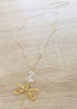 Long gold dragonfly necklace with clear Austrian crystals