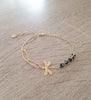 Gold dragonfly bracelet with black Austrian crystals