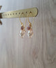 18K gold plated earrings featuring Golden Shadow Swarovski crystal drops on display