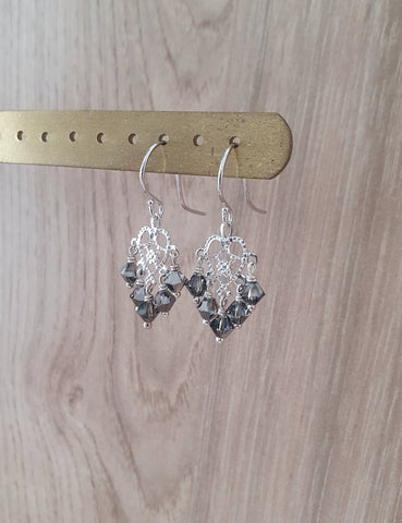 Rhodium plated heart filigree earrings with Black Diamond crystals