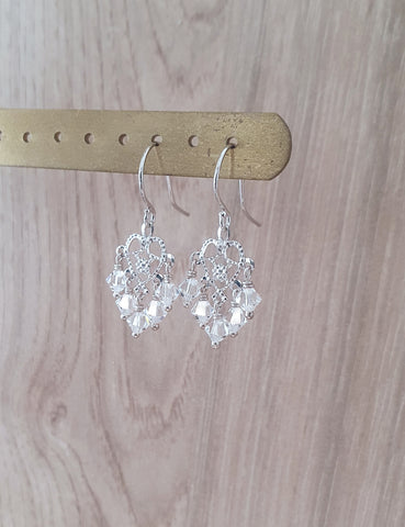 Rhodium plated heart filigree earrings with clear crystals