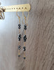 Gold dangle earrings with black Austrian crystals