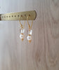 Gold earrings with white freshwater pearls and Austrian crystal butterflies