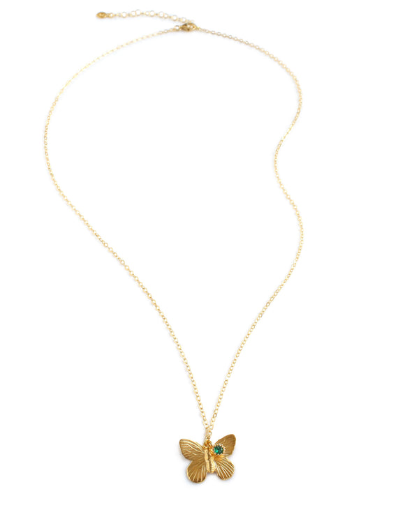 Gold butterfly necklace with an emerald crystal