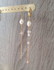 Rose freshwater pearl and diamond-cut crystal earrings on display