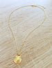 Dige Designs short gold seashell necklace with a Golden Shadow crystal