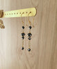 18K gold plated earrings with black Swarovski crystals on jewellery display