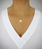 Dige Designs short gold seashell necklace with a Golden Shadow crystal