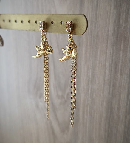 18K gold plated angel earrings with clear crystal earstuds and dangling chains on display