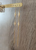 Long-length 18K gold plated double flowerlink earrings on display.