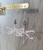 Silver dragonfly earrings decorated with sparkling Black Silver Night Swarovski crystals.