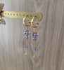 18K gold plated hoop earrings with Tanzanite Swarovski crystals on display