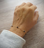 18K gold plated bracelet handmade and adorned with sparkling black Swarovski crystals on hand.