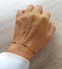 Classic 18K gold plated bracelet decorated with Denim Blue Swarovski crystals worn on hand.