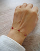18K gold plated chain bracelet decorated with sparkling Scarlet Red Swarovski crystals worn on hand.