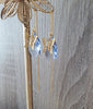 18K gold plated threader earrings with butterflies and Light Sapphire Swarovski drops on display