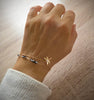 18K gold plated dragonfly double-chain bracelet with Black Silver Night Swarovski crystals on hand.