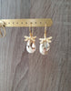 18K gold plated dragonfly earrings with Golden Shadow Swarovski crystal drops on jewellery display