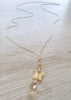 Long-length 18K gold plated butterfly necklace adorned with sparkling Golden Shadow Swarovski crystals.