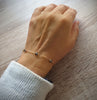 18K gold plated bracelet decorated with sparkling Black Silver Night Swarovski crystals worn on hand.