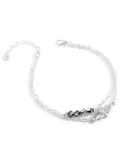 Silver double chain bracelet decorated with flowerlink and Black Silver Night Swarovski crystals.