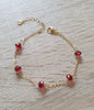 18K gold plated chain bracelet decorated with 5 sparkling Scarlet Red Swarovski crystals.