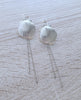 Long-length rhodium plated seashell statement earrings