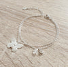Silver double chain butterfly bracelet decorated with clear Swarovski butterfly crystal and charm.