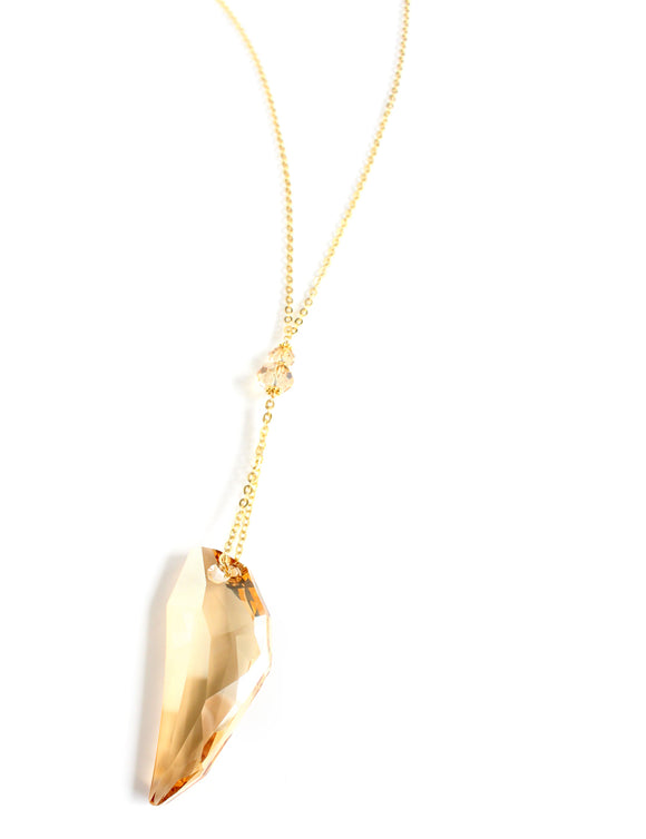 Long necklace with Golden Shadow tooth-pendant and crystals 