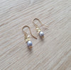 Light blue pearl earrings with Austrian crystal butterflies