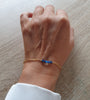 18K gold plated chain bracelet adorned with sparkling Montana AB Swarovski crystals worn on hand.