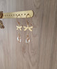 18K gold plated dragonfly earrings with "Golden Shadow" Swarovski crystal drops on jewellery display