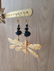 18K gold plated statement dragonfly earrings with black Swarovski crystals on display