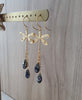 18K gold plated dragonfly earrings with "Black Silver Night" Swarovski crystal drops on jewellery display