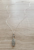 Long silver necklace with grey Swarovski pavé pendant