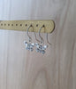 Rhodium plated butterfly earrings with Austrian Zirconia on display