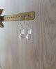 Rhodium plated earrings with grey freshwater pearls and clear Swarovski crystal butterflies