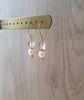 Dige Designs gold earrings with white freshwater pearl and Swarovski crystal butterflies