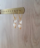 18K goldplated white pearl earrings featuring clear Swarovski crystal butterflies