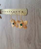 Dige Designs gold butterfly earrings with emerald Swarovski crystals