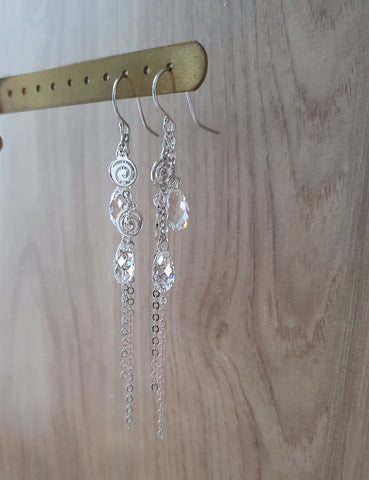 Silver earrings with clear crystal drops and swirls