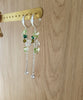 Silver hoop earrings with Peridot butterflies and crystals