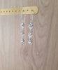 Silver swirl coin earrings with clear Austrian crystals