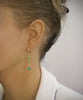 Gold hoop and Swarovski peridot butterfly earrings