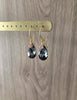 18K gold plated earrings with Black Silver Night Swarovski crystal drops on jewellery display
