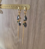 Long-length 18K gold plated hoop earrings with Black Silver Night Swarovski drops on display